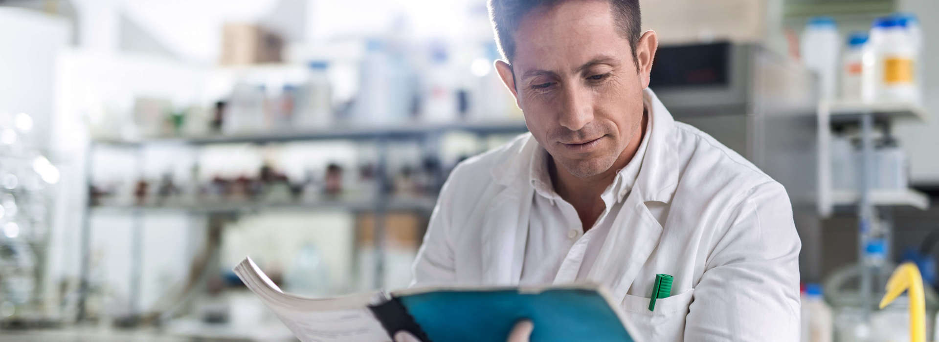 Scientist Reading Catalogue Istock 504611202